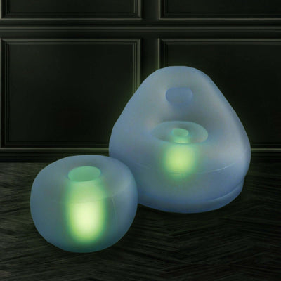 Illuminated inflatable chair and ottoman set in a modern design.