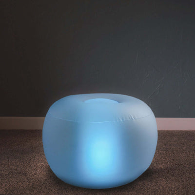 Illuminated blue pouf with a rounded design, perfect for stylish decor.