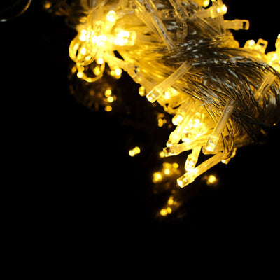 Warm white LED string lights on a dark background.
