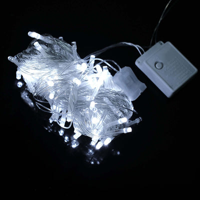 LED fairy lights on a dark background with a battery pack.