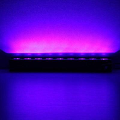 Purple LED light strip against a smooth backdrop.