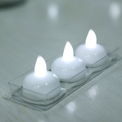 Three white LED tea light candles in a clear tray.