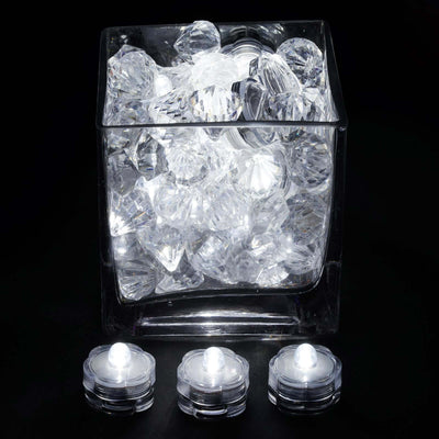 Crystal decorative gems in clear glass container with LED lights.