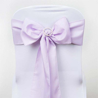 Lavender chair sash with pearl embellishment on a white chair
