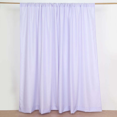 Light purple curtain hanging from a rod on a plain background.