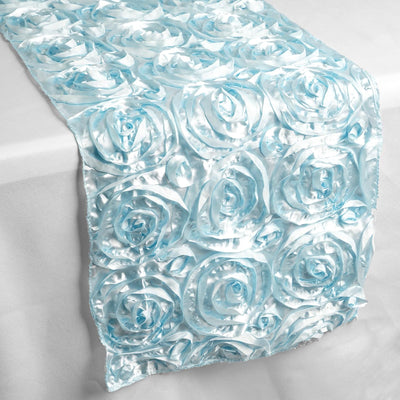Blue satin rose table runner with textured floral design.