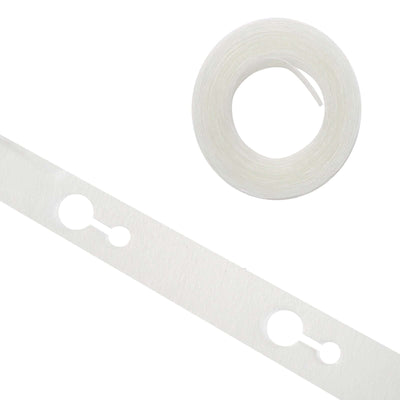 Clear adhesive tape roll and strip on a plain background.