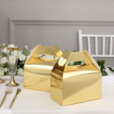 Gold gift boxes on a dining table with elegant decor.