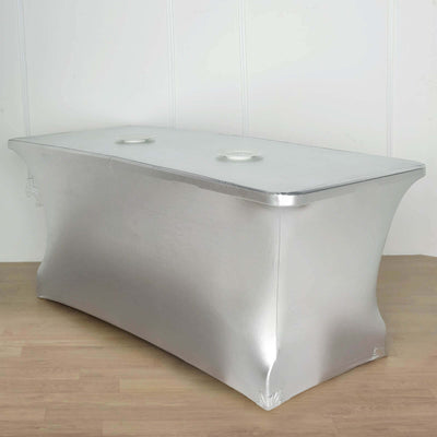 Silver table cover with cutouts for easy access to table surface.