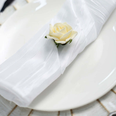 Elegant white napkin with a rose on a plate