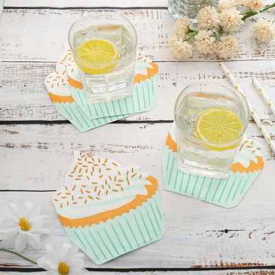 Cupcake-shaped coasters with glasses of lemonade on a rustic wooden table.
