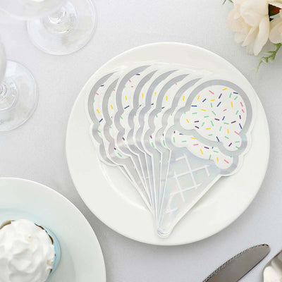 Ice cream cone-shaped coasters on a plate, featuring colorful sprinkles.