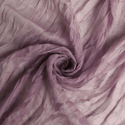 Textured purple fabric in a swirling pattern.