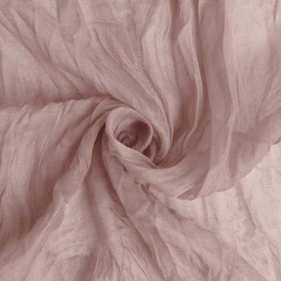 Soft pink sheer fabric with a wrinkled texture.