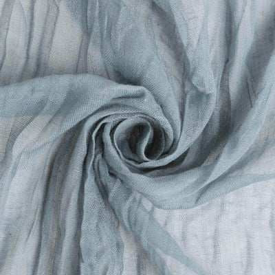 Light blue textured fabric in a spiral arrangement.