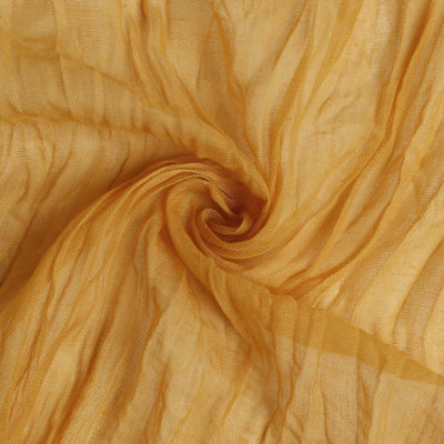 Golden sheer fabric with a wrinkled texture.