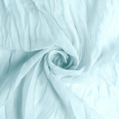 Light blue textured fabric in a swirl pattern.