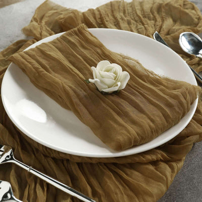Elegant brown table runner with a white rose on a plate.