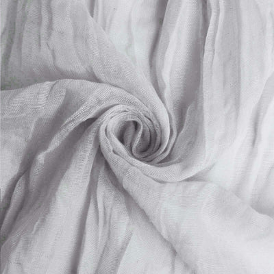 Textured gray fabric swirling in a circular pattern.