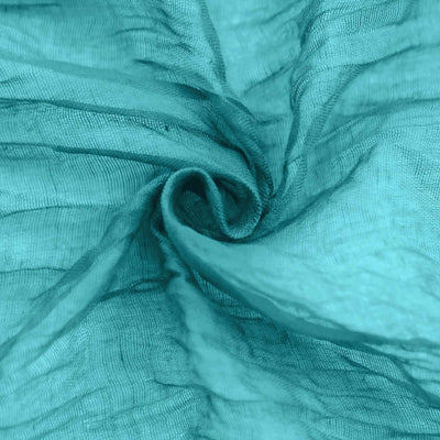 Textured aqua fabric in a soft, flowing design.