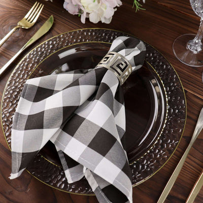 Black and white checkered napkin on an elegant plate setting.