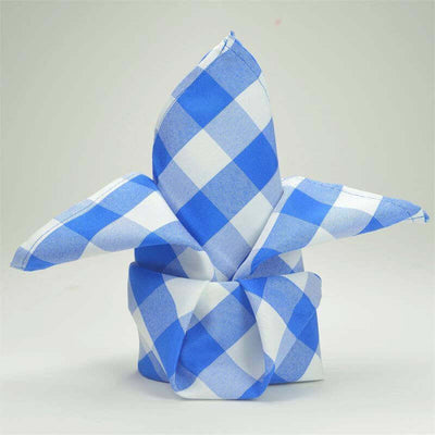Blue and white checkered napkin folded into a decorative shape.