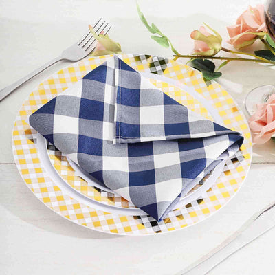 Navy and white checkered napkins on a colorful plate setting.