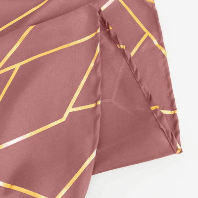 Rose gold geometric patterned fabric swatch on a white background.