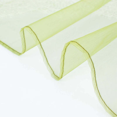 Translucent green fabric with delicate lace trim detail.
