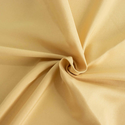 Yellow fabric with smooth texture, showcasing its soft drape and quality.