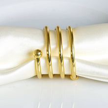 Enticing Gold Plated Aluminum Napkin Rings - 4/pk#whtbkgd