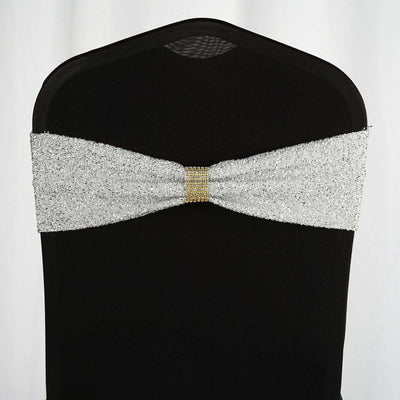 Silver glitter chair sash with gold accent on a black chair.