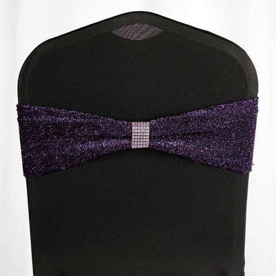 Purple glitter chair sash with rhinestone accent on a black chair.