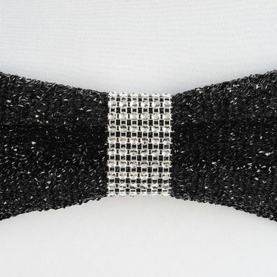 Black bow tie with sparkling crystal embellishment on a white background