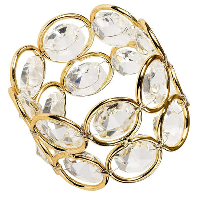 Gold and clear crystal bracelet with oval shapes on a white background
