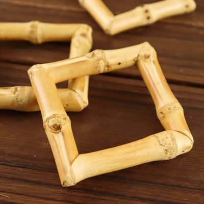 Bamboo coasters arranged on a wooden surface.