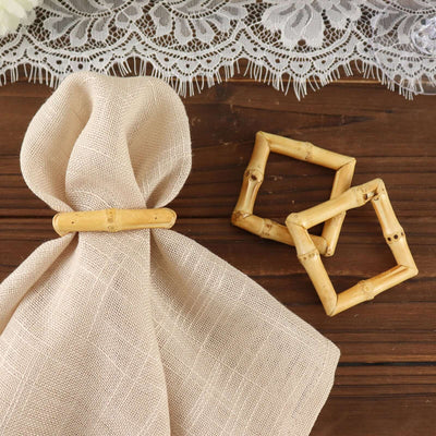 Bamboo napkin ring and geometric decor on a rustic wooden table.
