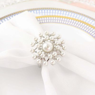 Elegant pearl napkin ring on a white table setting.