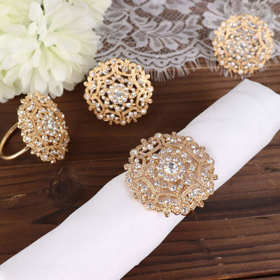 Gold and crystal decorative jewelry set on a napkin and lace