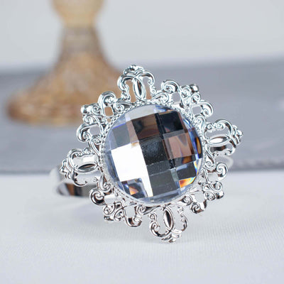 Elegant silver ring with a large round crystal centerpiece.