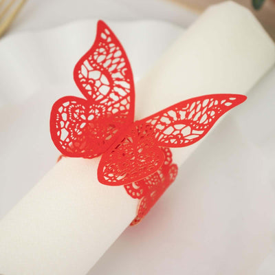 Red lace butterfly napkin ring on a white napkin.