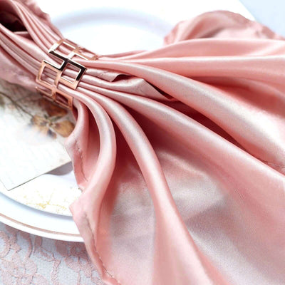 Pink satin fabric draped elegantly on a plate.