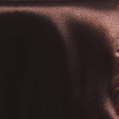 Abstract dark fabric texture with soft folds and shadows.