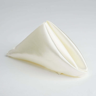 Ivory satin napkin elegantly folded in a cone shape