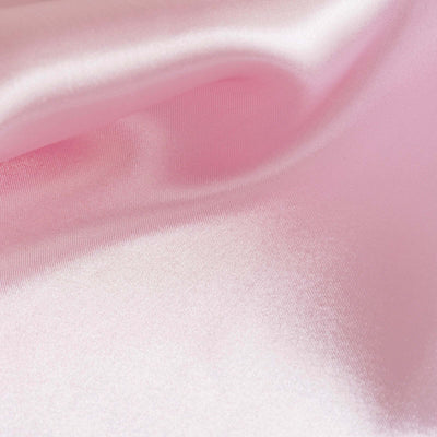 Soft pink satin fabric with a smooth texture.