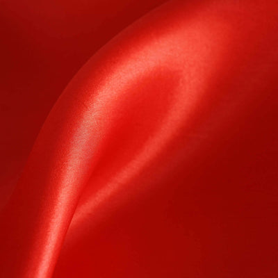 Smooth red satin fabric drape with soft sheen.