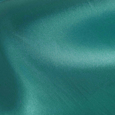 Teal satin fabric texture close-up, showcasing smooth and glossy surface details.