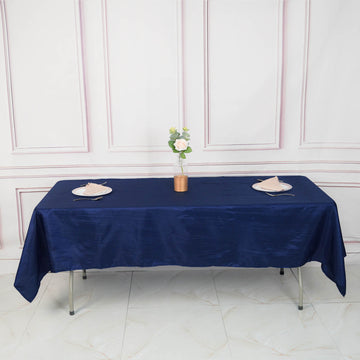 Elevate Your Event Decor with a Navy Blue Accordion Crinkle Taffeta Seamless Rectangle Tablecloth