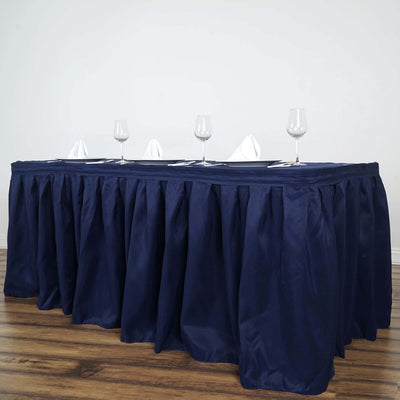 Navy table skirt with glasses and napkins for event decor