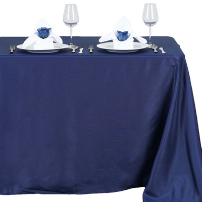 Navy blue tablecloth with elegant dinner setting for two